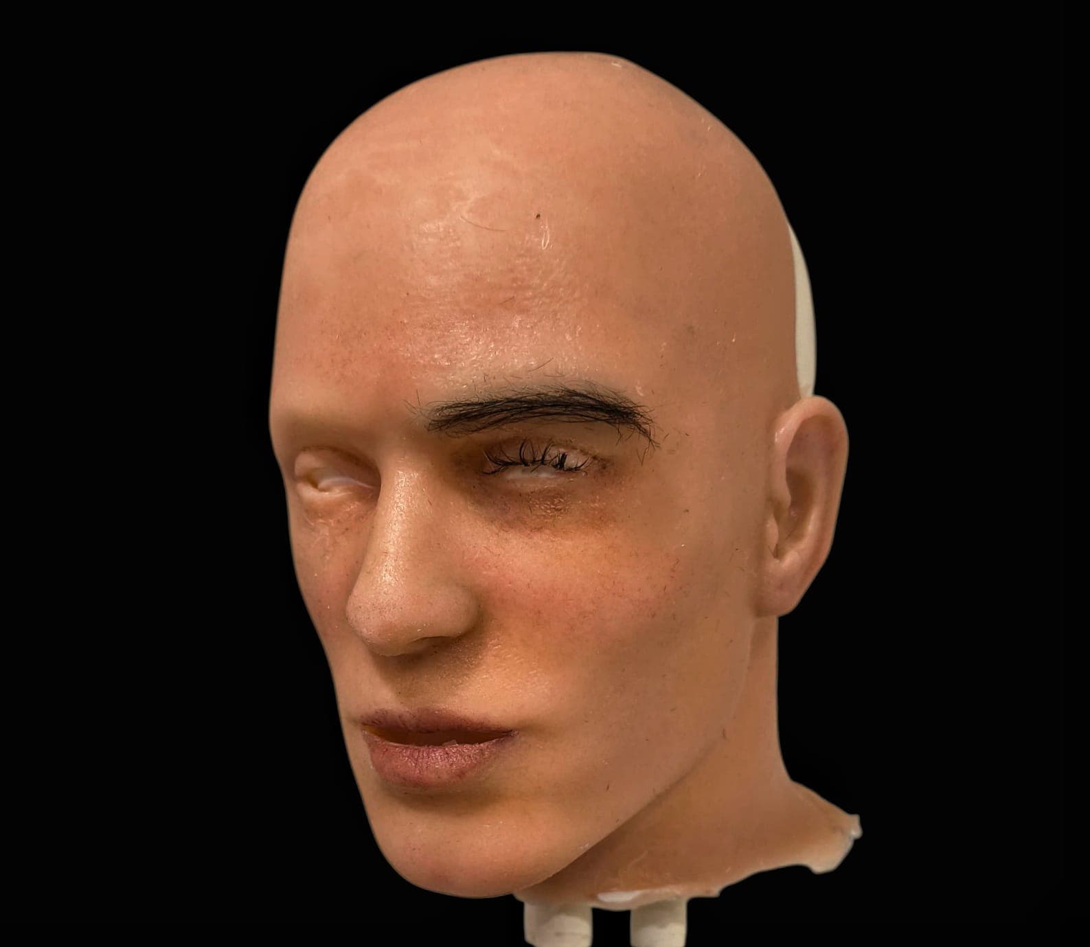 The face being painted and the hair punched in.